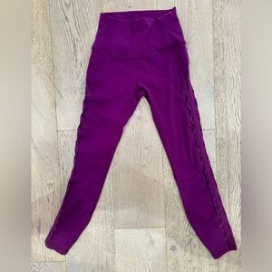 Lululemon Dark Magenta high-rise leggings. Sides criss-cross mesh. Size 4